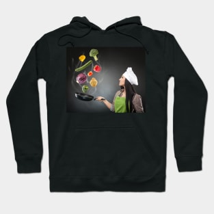 Skillful cook lady throwing veggies Hoodie